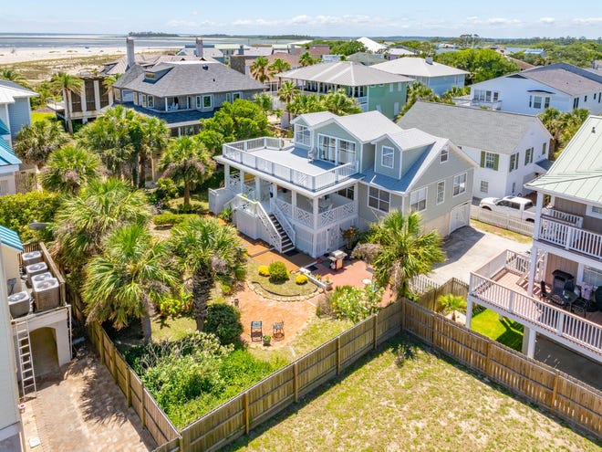 Experience the timeless allure of Tybee Island at 4 18th Terrace. Located on a double lot, this charming cottage, steeped in history since 1938 and modernized in 1995. Listed by Taavo Roos, Seabolt Real Estate.