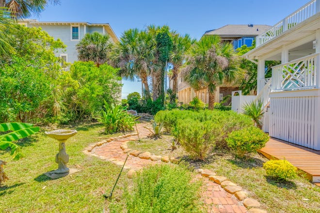 Experience the timeless allure of Tybee Island at 4 18th Terrace. Located on a double lot, this charming cottage, steeped in history since 1938 and modernized in 1995. Listed by Taavo Roos, Seabolt Real Estate.